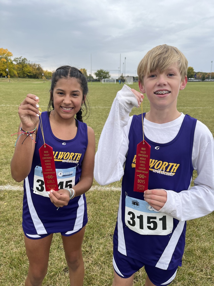 Two Cross Country Runners Hold Red Ribbons
