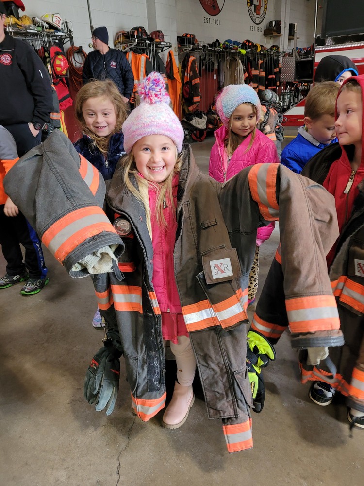 Students Try On Firefighter Coats