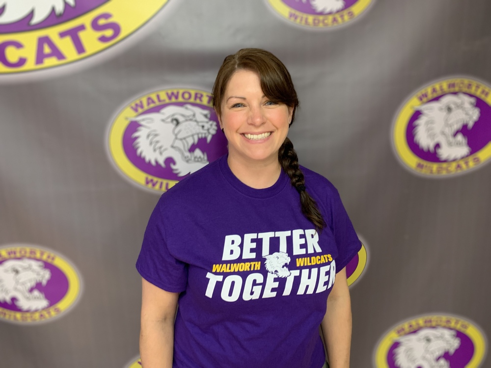 Mrs Stacey Zwirlein Band Director Photo with the Walworth Wildcat Background